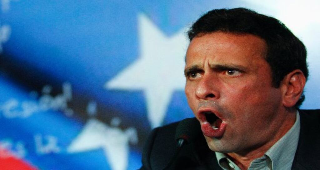 Henrique Capriles, Venezuela's opposition leader and governor of Miranda state, addresses the media in Caracas yesterday. Photograph: Carlos Garcia Rawlins/Reuters.