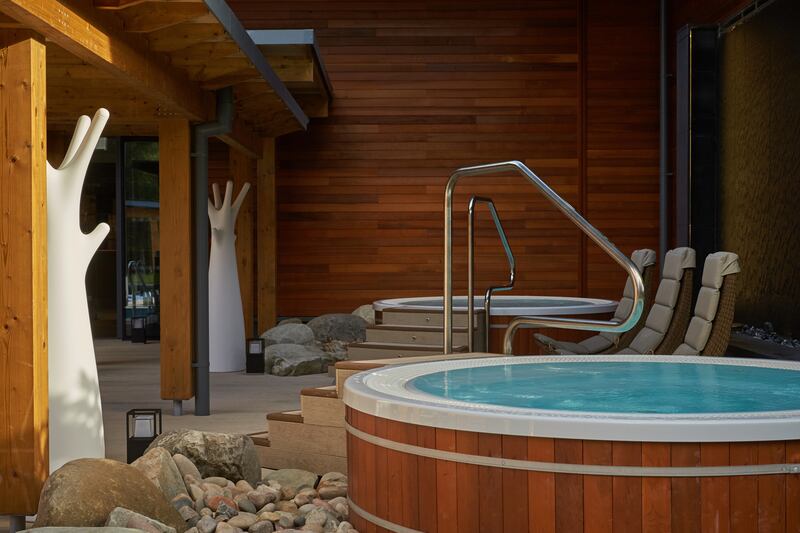 The outdoor hot tubs and lounge seating at Aqua Sana Forest Spa, Co Longford