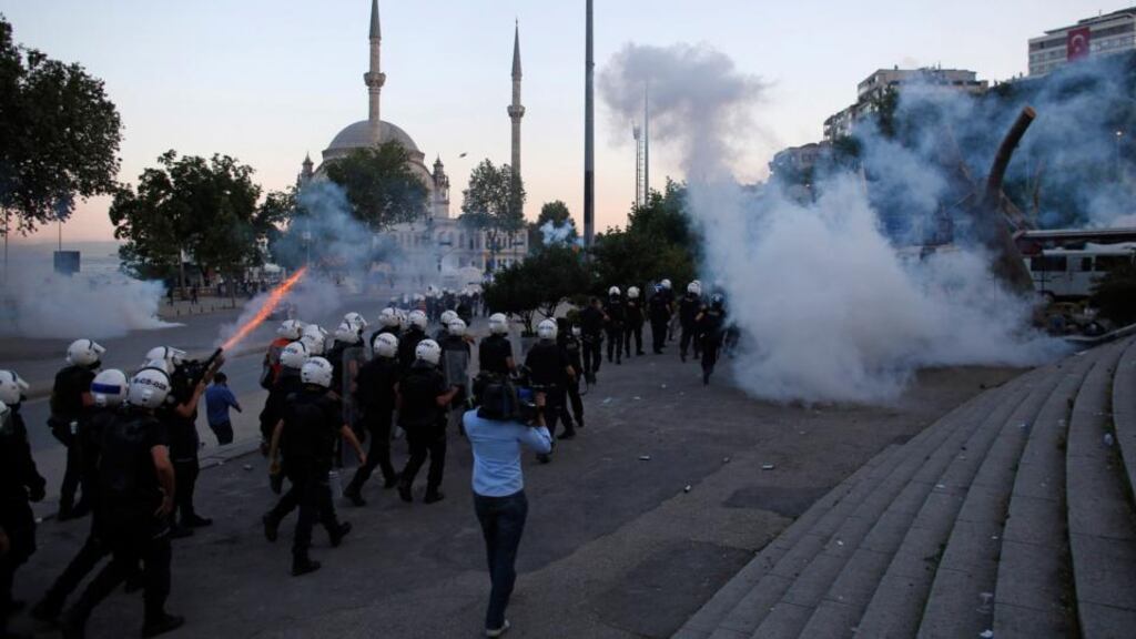 Riot police use tear gas to disperse the crowd during an anti-government protest in Istanbul yesterday.