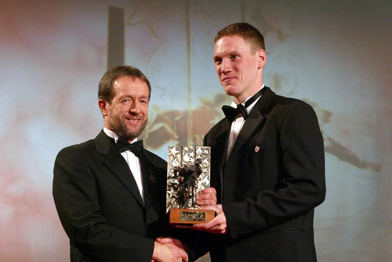 Cormac McAnallen recieves his All Star Award from GAA president Seán Kelly in 2003. Photograph: Morgan Treacy/Inpho