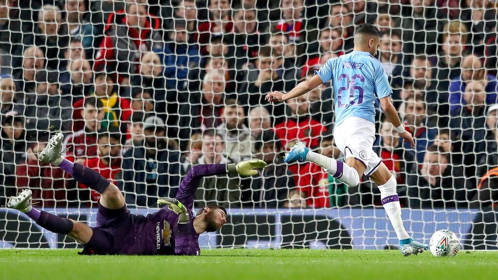 Riyad Mahrez of Manchester City takes the ball around David De Gea of Manchester United and scores his side’s second goal during the Carabao Cup semi final at Old Trafford. Photo: Michael Steele/Getty Images