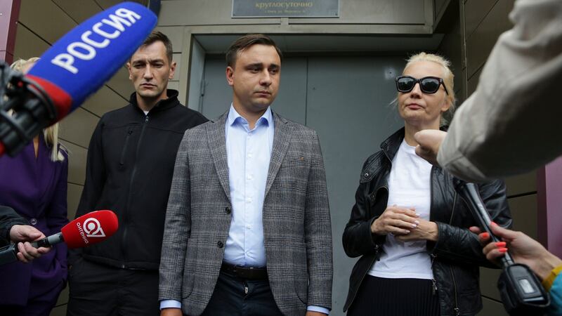 Alexei Navalny’s brother Oleg (left), Navalny’s colleague Ivan Zhdanov and Alexei Navalny’s wife Yulia speak to the media at the hospital in Omsk, Russia. Photograph: Evgeniy Sofiychuk/AP Photo
