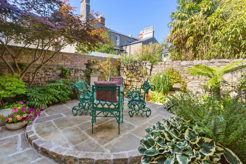 Sitting area in the back garden. Photograph: Viv van der Holst