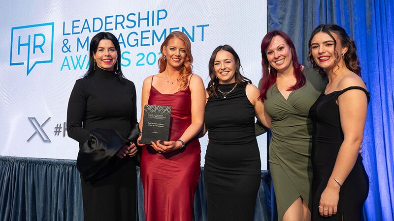 Maureen Walsh, managing director, DeCare, presents the best workplace (under 250+ employees) award to the Deciphex team