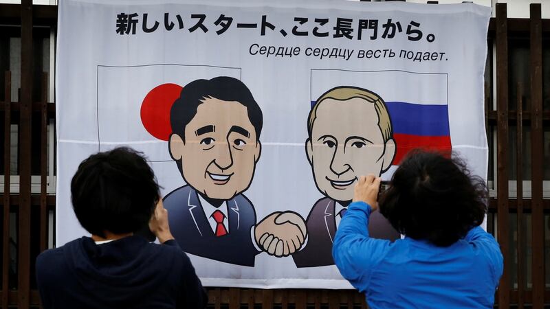 A banner showing Japan’s prime minister, Shinzo Abe, and Russia’s president, Vladimir Putin, in Nagato, Yamaguchi prefecture, Japan, ahead of their summit meeting. Photograph: Toru Hanai