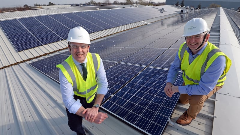 Joe O’Carroll  and Mark Lowen of Gaelectric Energy Solutions, with their solar roof installation on the roof of the Butlers Chocolate factory at Coolock, Dublin. Photograph: Eric Luke