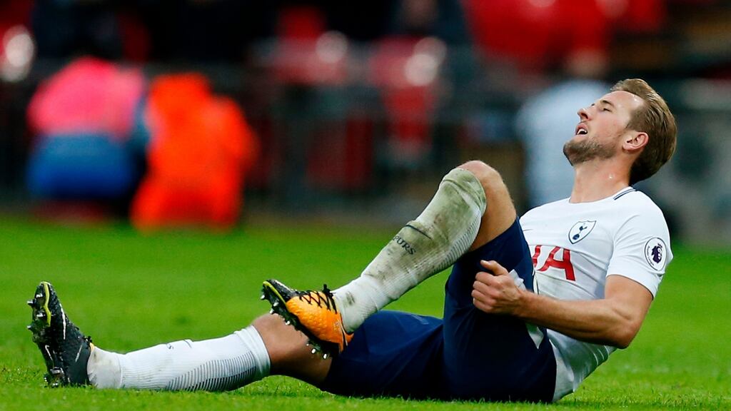 Tottenham Hotspur’s Harry Kane holds his hamstring after straining it in their win over Liverpool at Wembley. Photo: Ian Kington/Getty Images