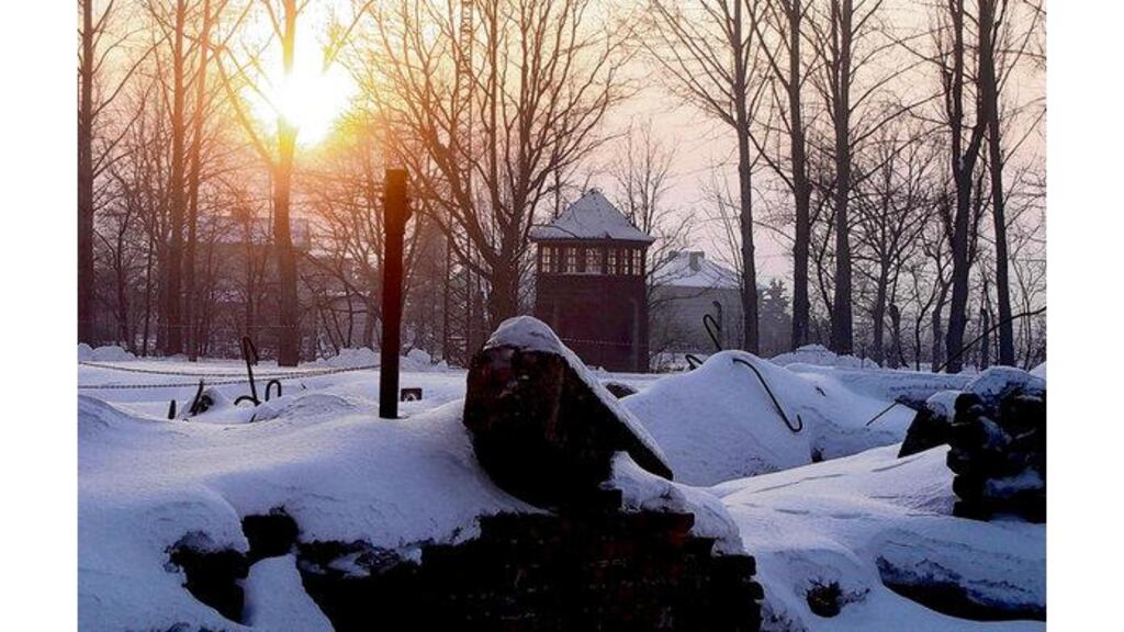 The sun sets over a smashed crematorium in the former Nazi death camp of Auschwitz-Birkenau in Oswiecim, southern Poland, yesterday. Some 150 survivors of the Nazi atrocities committed there joined Israel's Benjamin Netany, Shimon Peres and others to remember those who perished in the Holocaust. Photograph: Czarek Sokolowski/AP