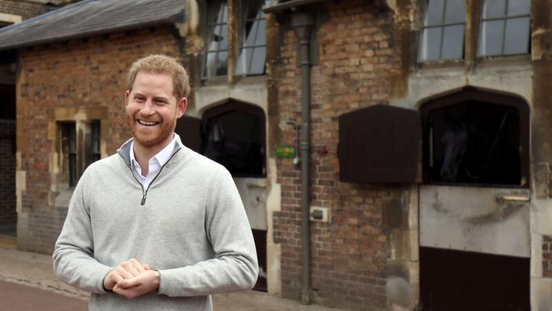 Britain’s Prince Harry speaks to members of the media at Windsor Castle following the announcement that Meghan, Duchess of Sussex, has given birth to a son. Photograph: Steve Parsons/AFP/Getty Images