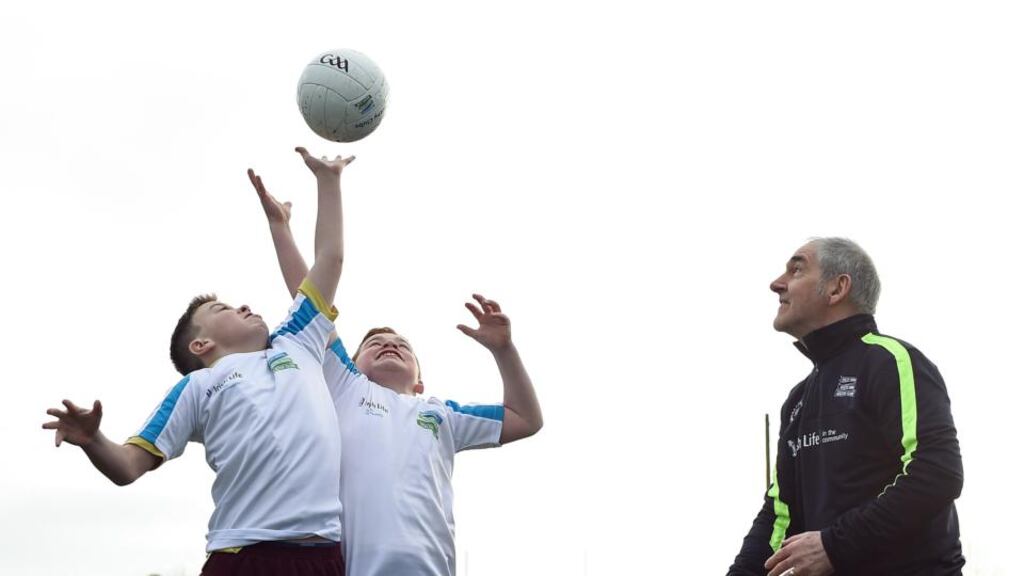 Aiming high: Tyrone manager Mickey Harte with Seán McHugh (11) and Jamie Smyth(11), from Scoil Chiaráin CBS, at the Healthy Clubs launch in Donnycarney, Dublin. Photograph: Cody Glenn/Sportsfile