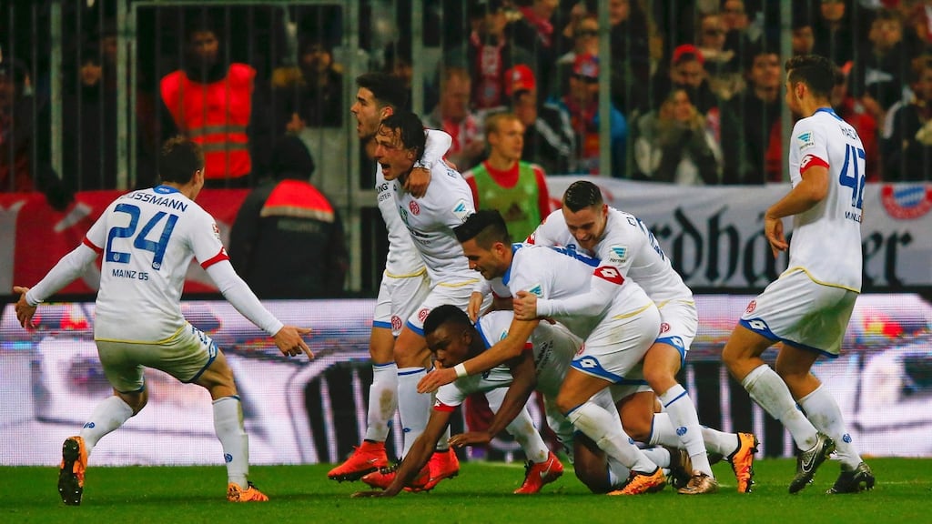 Mainz players celebrate Jhon Cordoba’s goal in the Bundeliga win over Bayern Munich at the Allianz Arena. Photograph: Michael Dalder/Reuters