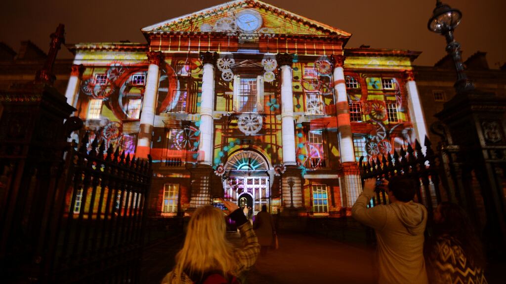 The facade of Trinity College Dublin was transformed into a projected-light retro clock for New Year’s Even 2013, in an appeal to Ireland’s diaspora. Photograph: Alan Betson/The Irish Times