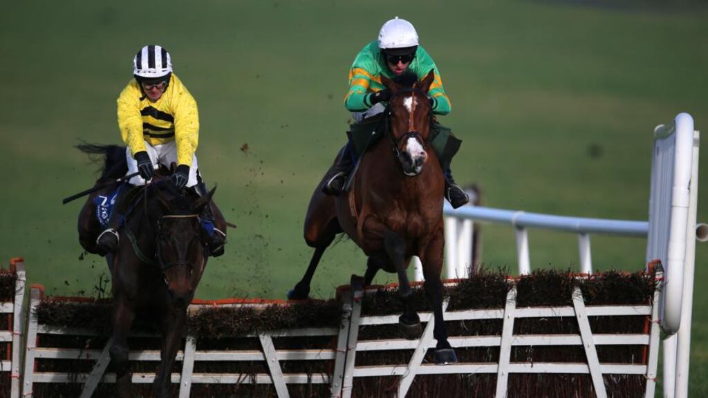 Jockey Mark Walsh on board Kitten Rock clears the last hurdle ahead of Glens Melody (David Casey) at Naas in January. Photograph: Cathal Noonan/Inpho