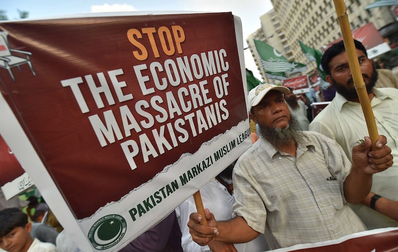 A supporter of Pakistan Markazi Muslim League during a protest against rising inflation in Karachi, Pakistan. Photograph: Shahzaib Akber/EPA