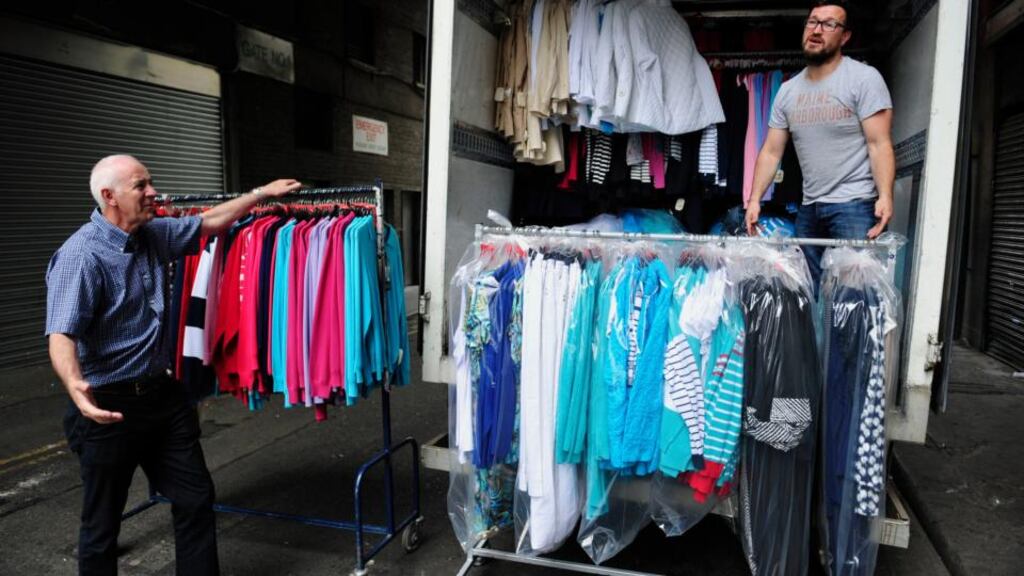 Mick Harris and Robbie O’Connor of the Best of Irish Design clothing firm load stock from the now-closed Clerys department store into a van on Wednesday, June 17th, 2015. Photograph: Aidan Crawley