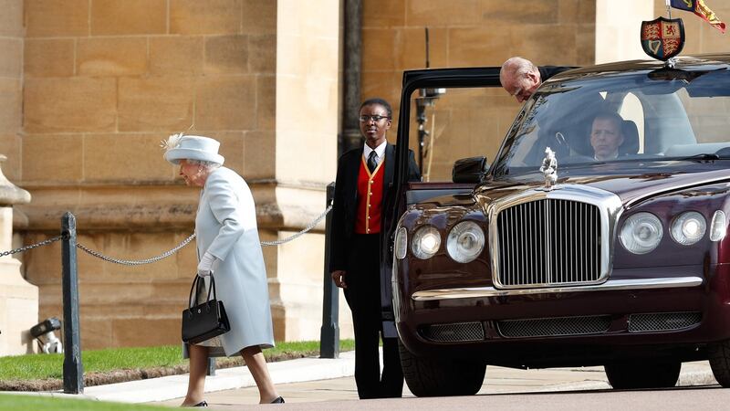 Britain’s Queen Elizabeth II (left) and Britain’s Prince Philip, Duke of Edinburgh (right) arrive to attend the wedding of Britain’s Princess Eugenie of York to Jack Brooksbank at St George’s Chapel, Windsor Castle, in Windsor. Photograph: Getty