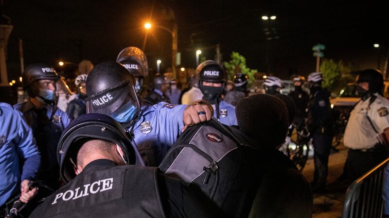 Police detain protesters demonstrating against the killing of Walter Wallace jnr who are in violation of the 9pm curfew in Philadelphia, on Wednesday. Photograph: Victor J Blue/The New York Times