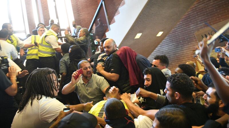 Protestors invade Kensington Town Hall following the fire at Grenfell Tower. Photograph: Facundo Arrizabalaga