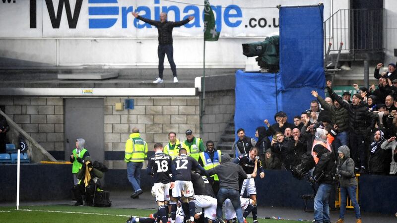 Aiden O’Brien of Millwall celebrates with team mates after scoring his side’s second goal during the FA Cup quarter-final win over Brighton and Hove Albion at The Den. Photo: Mike Hewitt/Getty Images
