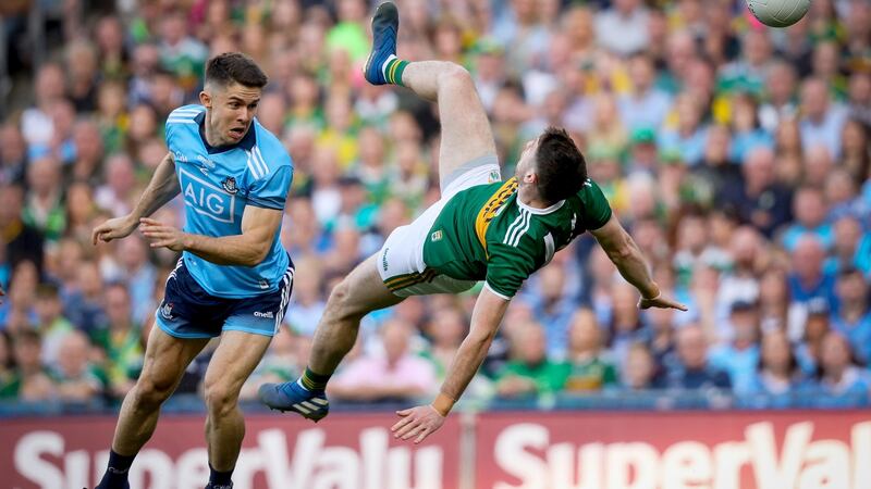 Dublin’s David Byrne tackles Paul Geaney of Kerry. Photograph: Oisin Keniry/Inpho