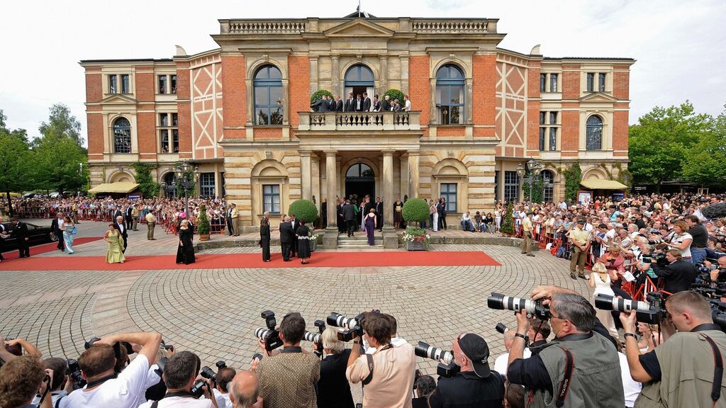 Guests arrive at the “Festspielhaus” for Bayreuth Wagner music festival in 2008: this year’s festival has been plagued with drama, from conductors walking out to organisers rescinding its invitation to German performance artist Jonathan Meese in horror at the running costs for his proposed staging. Photograph: Joerg Koch/AFP/Getty