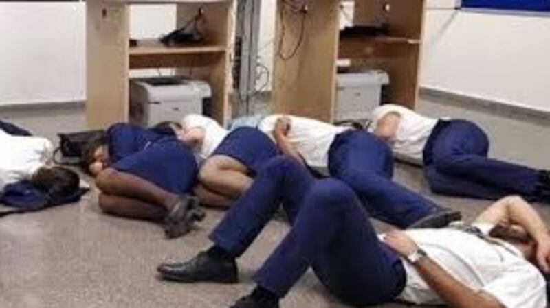 The phtographed released by Ryanair crew showing them sleeping on the floor.