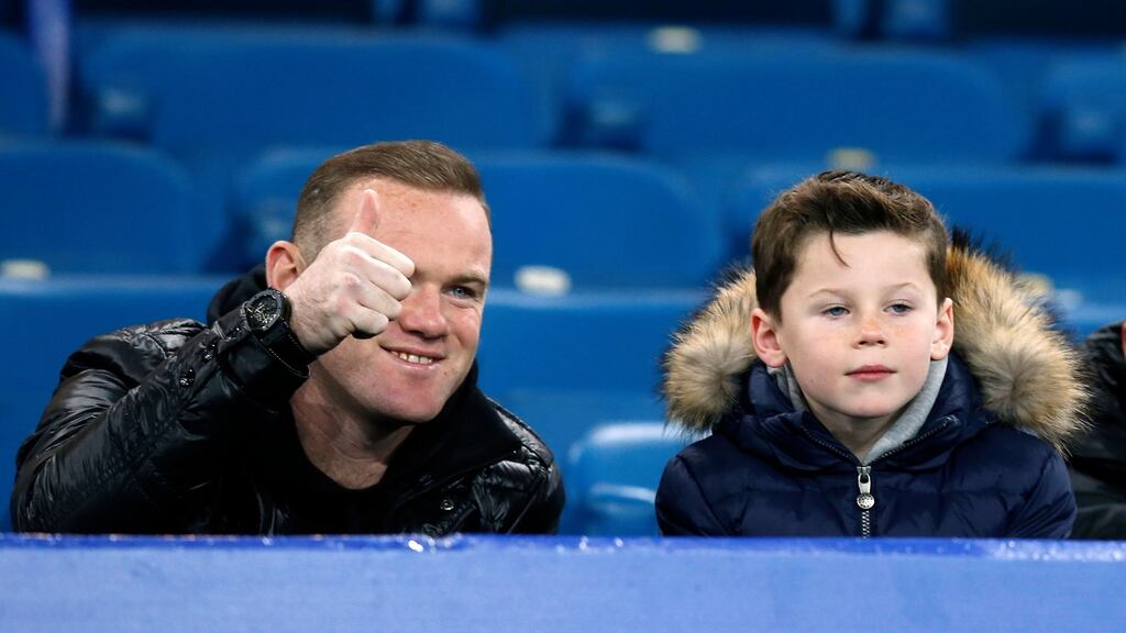 Manchester United’s Wayne Rooney with his son Kai at the Premier League match between Everton and Crystal Palace at Goodison Park last night. Photo: Peter Byrne/PA
