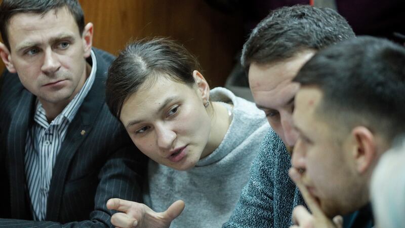Suspect Yana Duhar speaks with her lawyers at the Pecherskiy district court in Kiev. Photograph: Sergey Dolzhenko