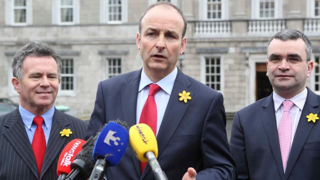 Fianna Fáil’s Seán Fleming, leader Micheál Martin and Dara Calleary outside the Dáil yesterday. Mr Martin claimed in the Dáil that the Garda commissioner “was pushed aside following a series of deeply suspicious events”. Photograph: Sam Boal/Photocall Ireland