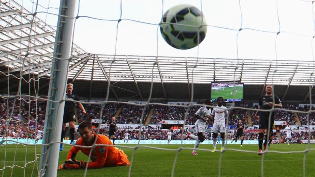 Despair for goalkeeper Thomas Heaton of Burnley after Nathan Dyer of Swansea City (cenre)scored the winner at Liberty Stadium. Photograph: Michael Steele/Getty Images