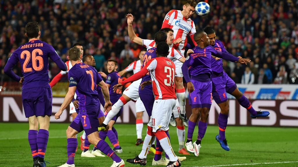 Red Star Belgrade’s Serbian forward Milan Pavkov heads in his team’s first goal against Liverpool. Photograph: Getty Images