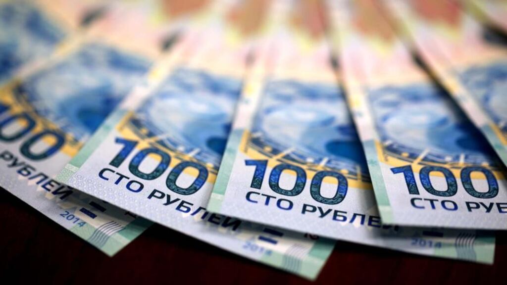 Russian 100 ruble denomination banknotes, commemorating the upcoming Sochi 2014 Winter Olympics. Photographer: Andrey Rudakov/Bloomberg