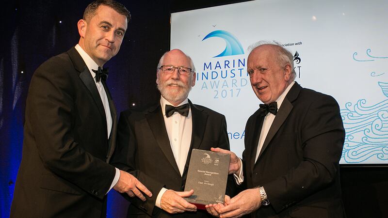 Conor Mowlds and Brendan Tuohy, NMCI presents the Special Recognition Award to Capt. Viv Gough.