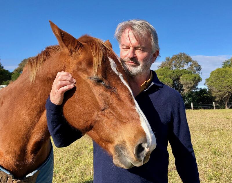 Sam Neill, right, and a horse