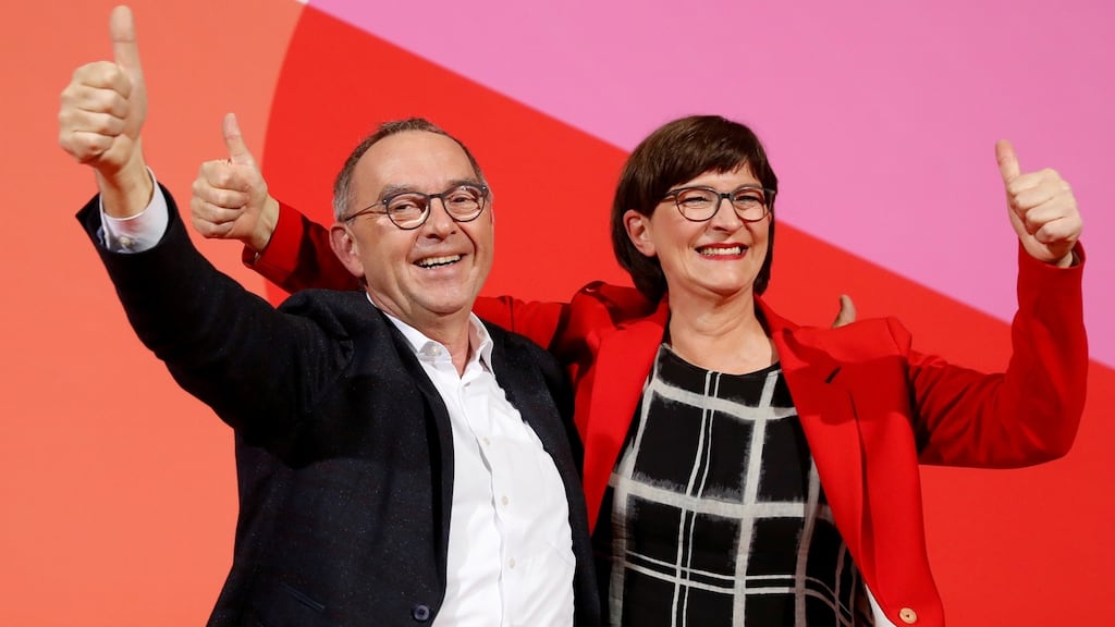 Norbert Walter-Borjans and  Saskia Esken celebrate on Saturday after their election as joint leaders of Germany’s junior coalition partner, the SPD. Photograph: Fabrizio Bensch/Reuters