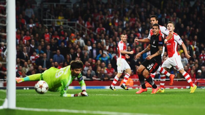 Alexis Sanchez (2nd right) of Arsenal shoots and scores past Tolga Zengin of Besiktas at the Emirates Stadium. Photograph: Shaun Botterill/Getty Images