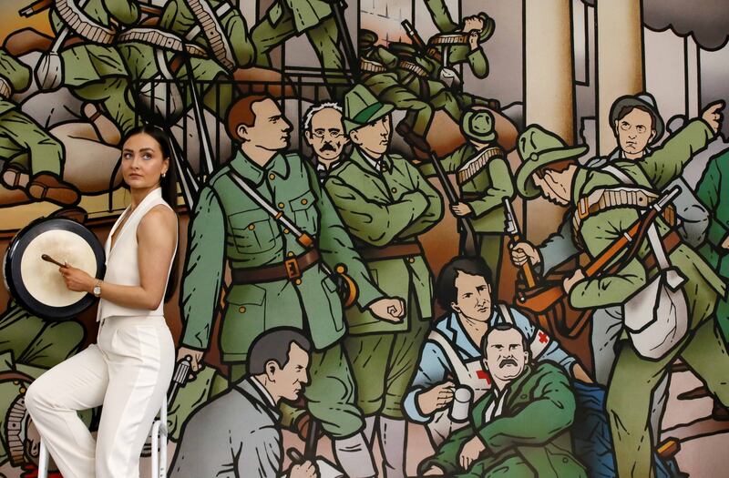 Tara Brady with Cailíní Lua in front of Robert Ballagh’s The Birth of the Irish Republic at the announcement of the programme for TradFest 2024. Photograph: Mark Stedman