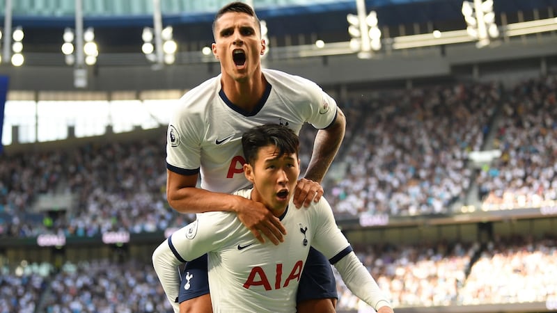 Tottenham Hotspur’s Son Heung-Min celebrates with Erik Lamela after he scores the team’s first goal during the Premier League match against Crystal Palace at Tottenham Hotspur Stadium. Photograph: Daniel Leal-Olivas/AFP/Getty Images
