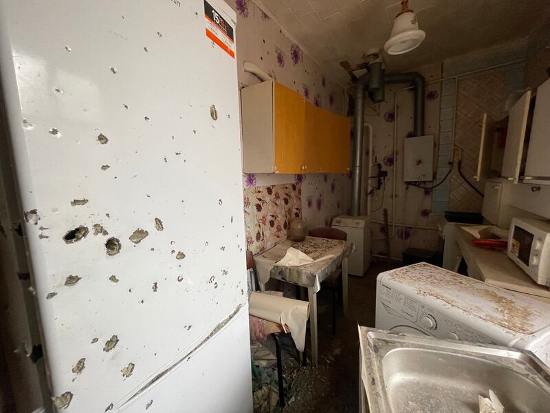 Shrapnel holes in the fridge at the Pivovar family's cottage in Mospanove, northeastern Ukraine, which was on the frontline of the Ukraine-Russia war until Kyiv's successful counter-offensive this month. Photograph: Daniel McLaughlin