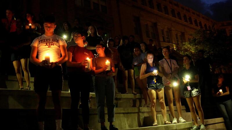 Mourners taking part in a vigil at El Paso High School. Photograph: REUTERS/Jose Luis Gonzalez