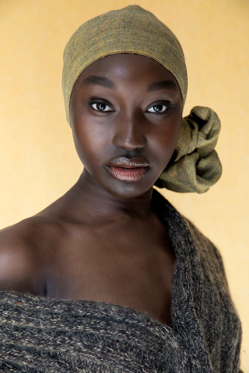Skinny Irish linen scarf worn as headscarf (€120) worn with a Stable blanket. Photograph: Barry McCall