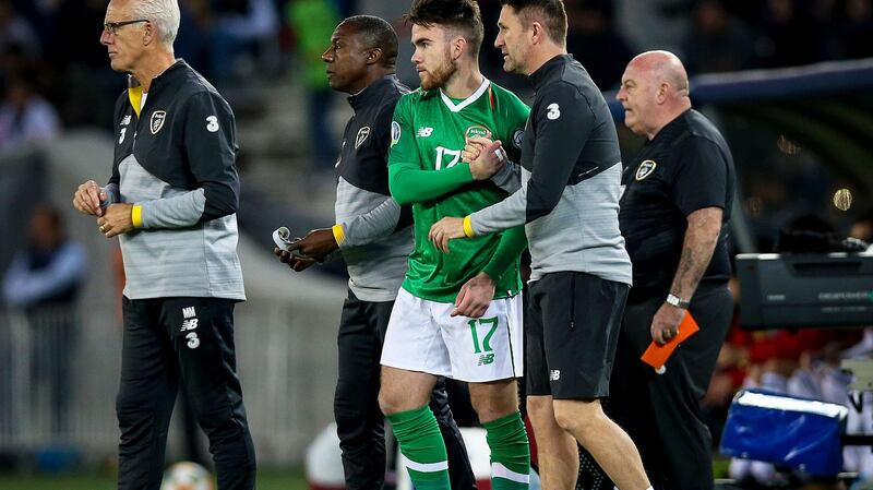 Ireland’s Aaron Connolly with manager Mick McCarthy and assistant manager Robbie Keane before coming on during the Euro 2020 qualifier against Georgia. Photo: Tommy Dickson/Inpho