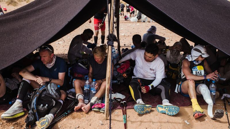 Amy Palmiero-Winters, far right, sits in a checkpoint tent during day four.