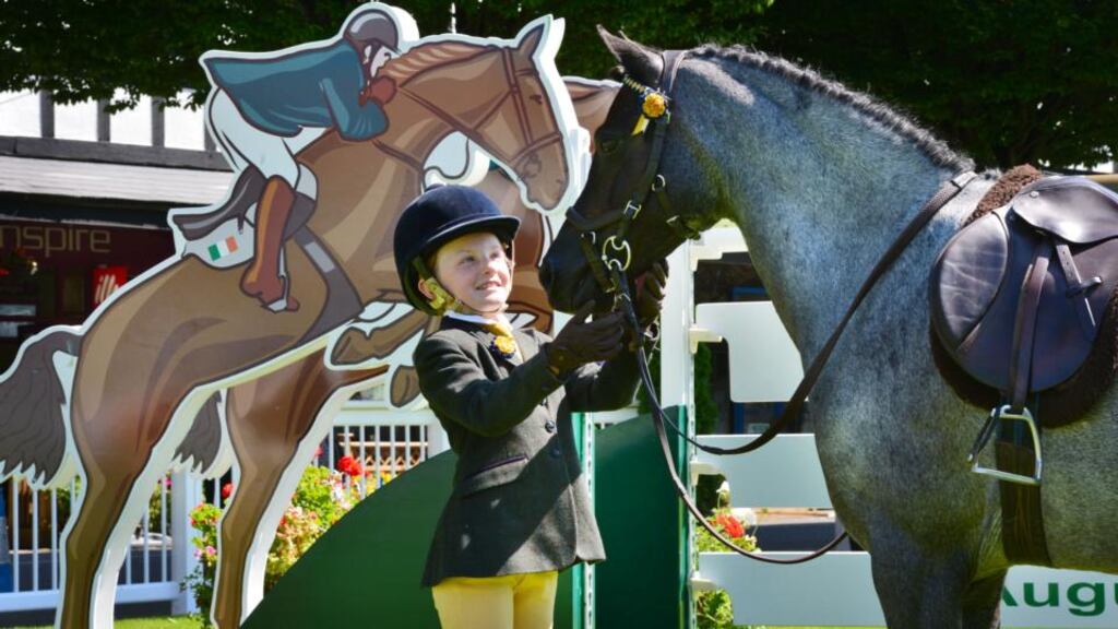 Holly Duggan (8), from Enniskerry, Co Wicklow, with her pony, Sparkling Silver, at the launch of the 2013 Dublin Horse Show , which will take place at the RDS from August 7th to 11th. Holly will be competing for the first time at the show. Photograph: Alan Betson