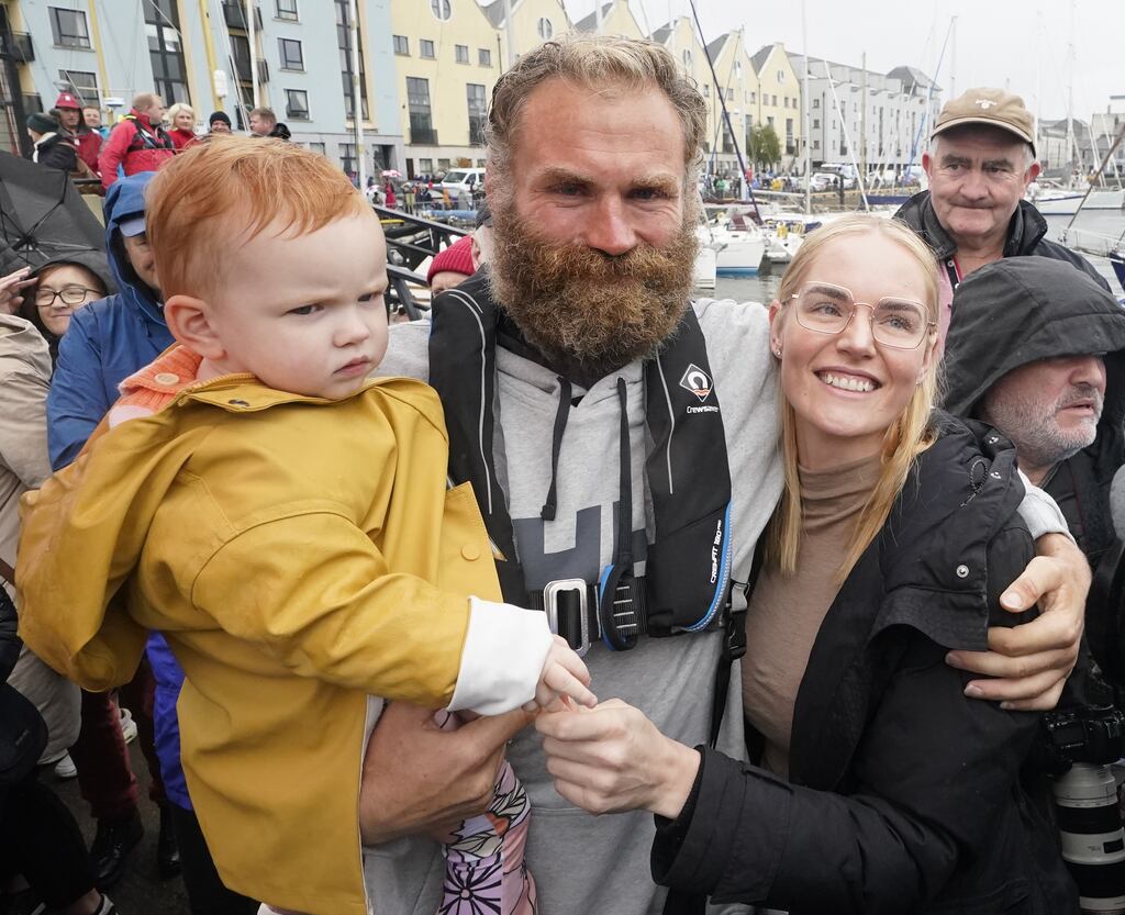Former professional rugby player Damian Browne is greeted by his wife Rozelle Bothma and daughter Elodie Browne as he arrives in Galway after becoming the first person to row from New York to Galway at sea. He spent 112 days at sea during his solo voyage across the Atlantic. Photograph: PA Wire