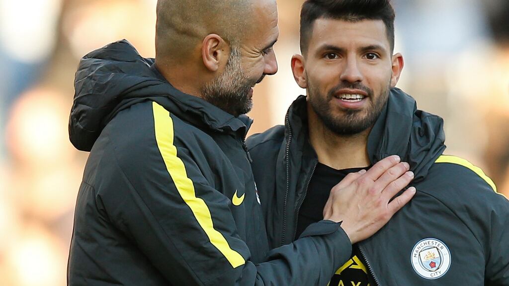 Manchester City manager Pep Guardiola with Sergio Aguero after the match at Turf Moor. Photograph: Reuters