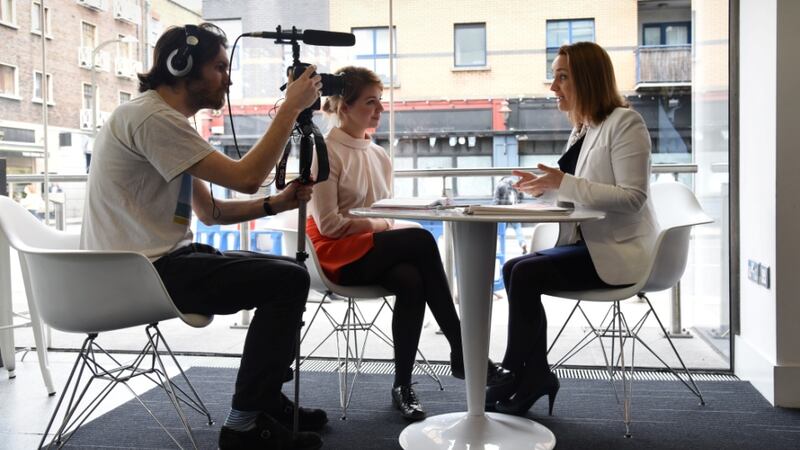 Felicity McCarthy from Spark Digital outlining her approach to social media with reporter Caitríona Mc Bride and videographer Eoghan O'Brien