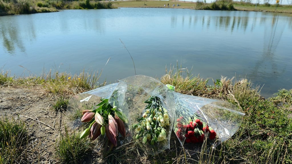 File photograph of flowers at the scene at Tyrrelstown park, west Dublin, where a Ahmed Bari drowned in the pond near his home. An inquest returned a verdict of accidental death. Photograph: Eric Luke