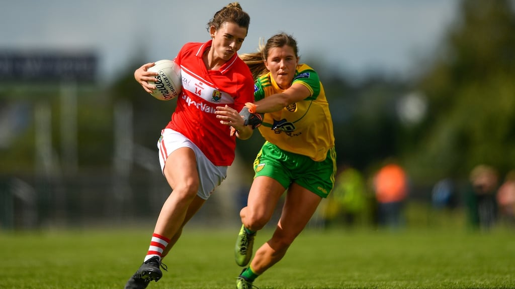 Cork’s Doireann O’Sullivan in action against Ciara Hegarty of Donegal during the TG4 All-Ireland ladies football semi-final at Dr Hyde Park. Photograph:  Eóin Noonan/Sportsfile
