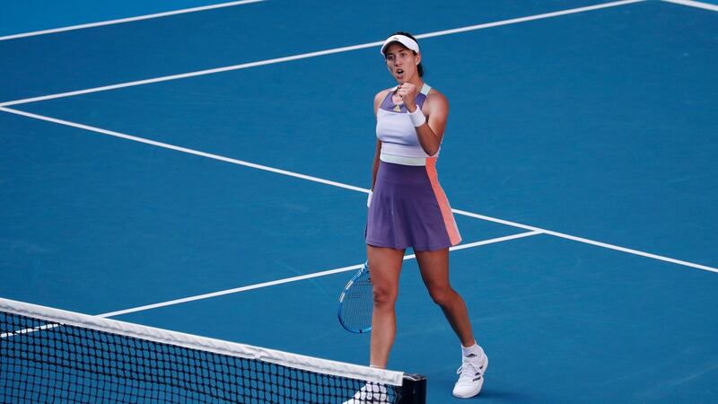 Garbine Muguruza celebrates winning her women’s singles semi-final against Simona Halep. Photo: Roman Pilipey/EPA